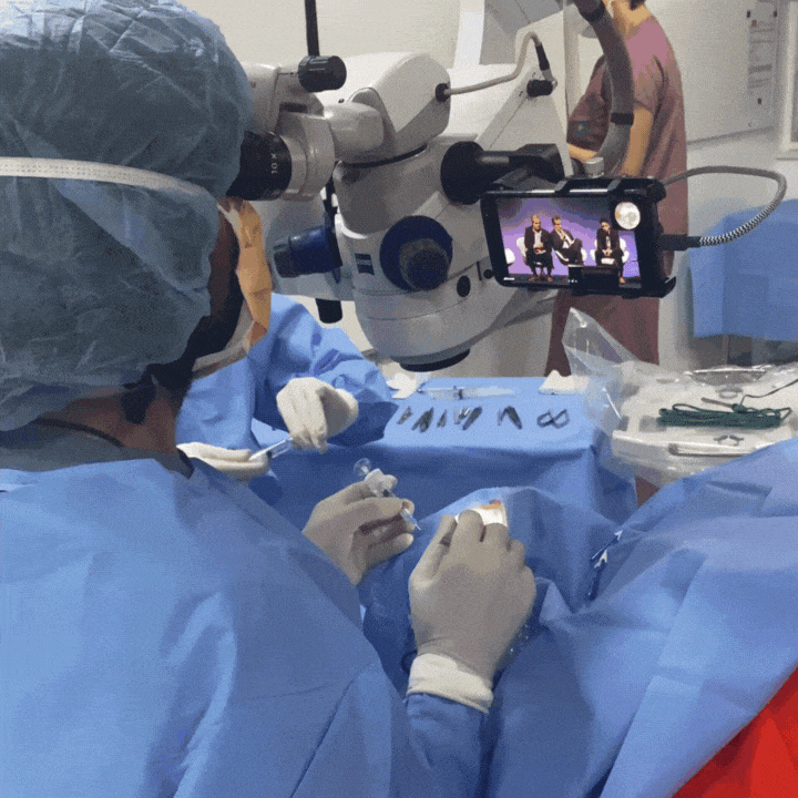 Dr. Ike Ahmed, ophthalmologist, in a OR, streaming a complex surgery with MicroREC and MicroREC App in zoom at BRASCRS 2023